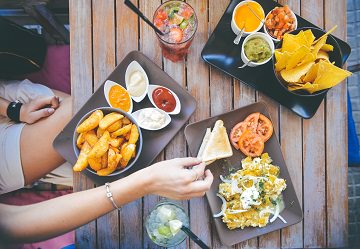 picture of people eating healthy tapas at a table